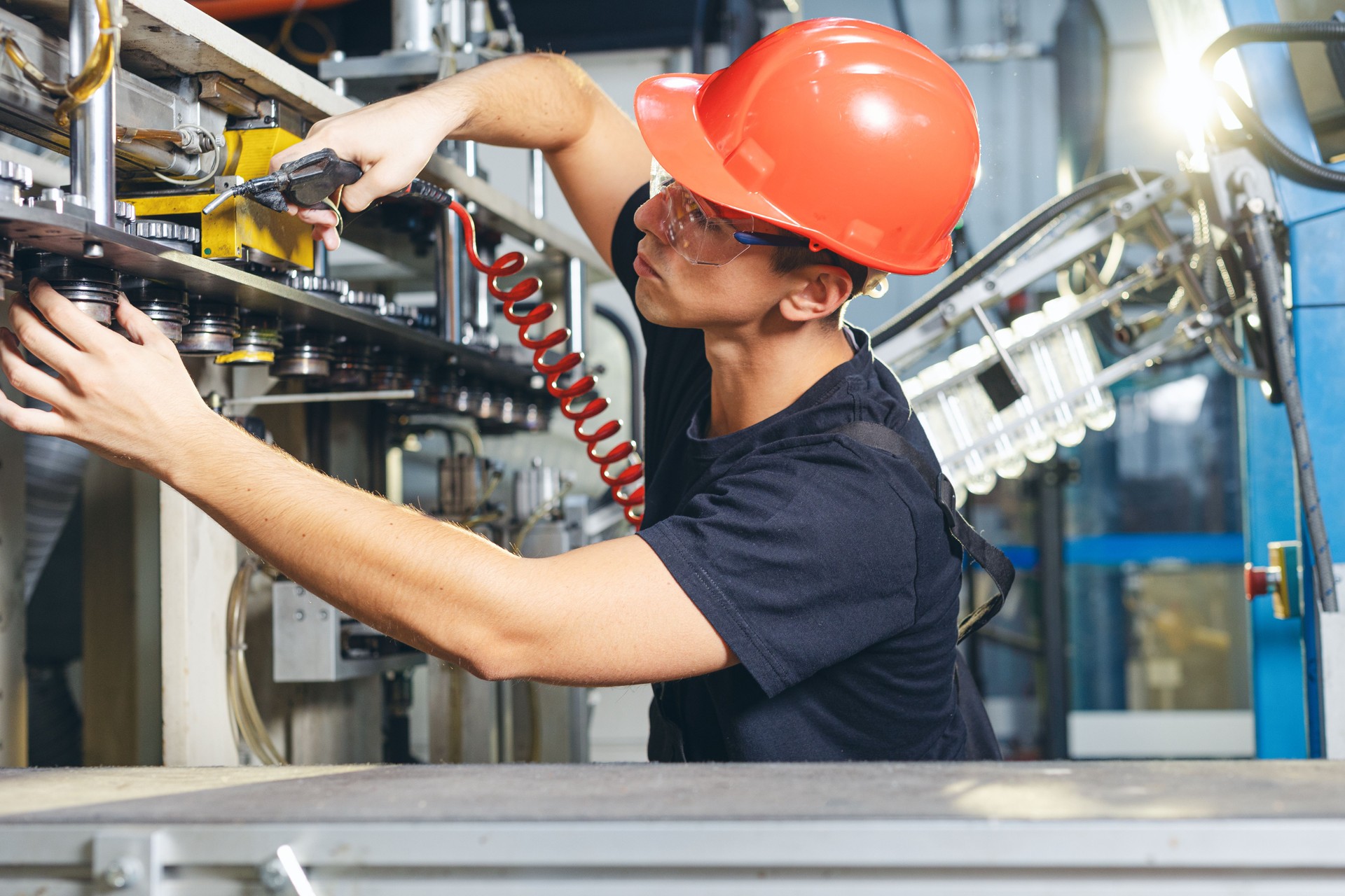 Engineer in uniform helmet inspection check control heavy machine